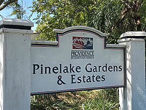Pinelake Gardens and Estates Logo