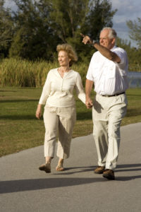 A couple walking on a paved trail